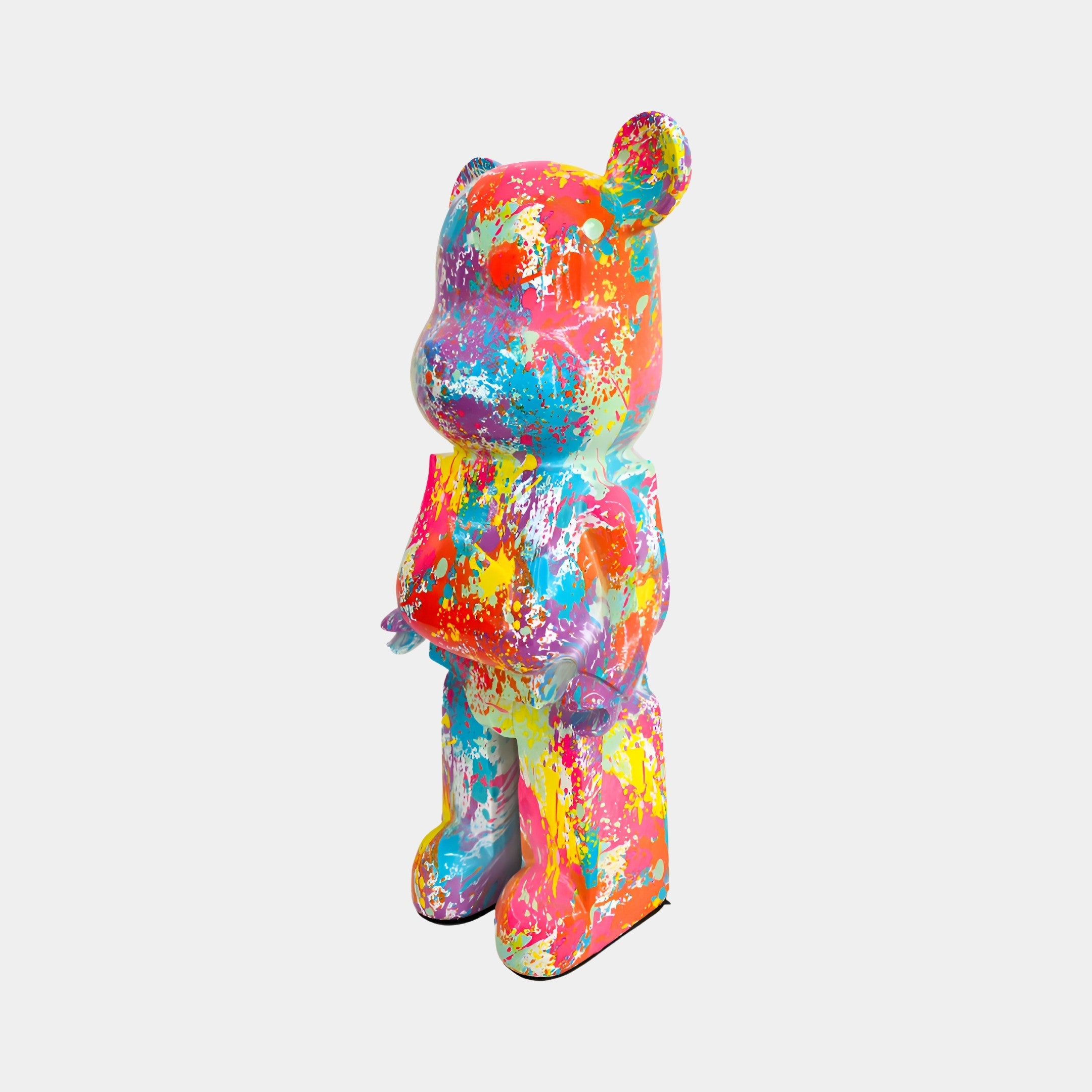 Profile view of the 50cm Hype bear sculpture showcasing its dynamic and colorful splash design.