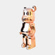 Side view of Rose Gold Bear Sculpture, showcasing the sleek, polished surface in a modern art design.