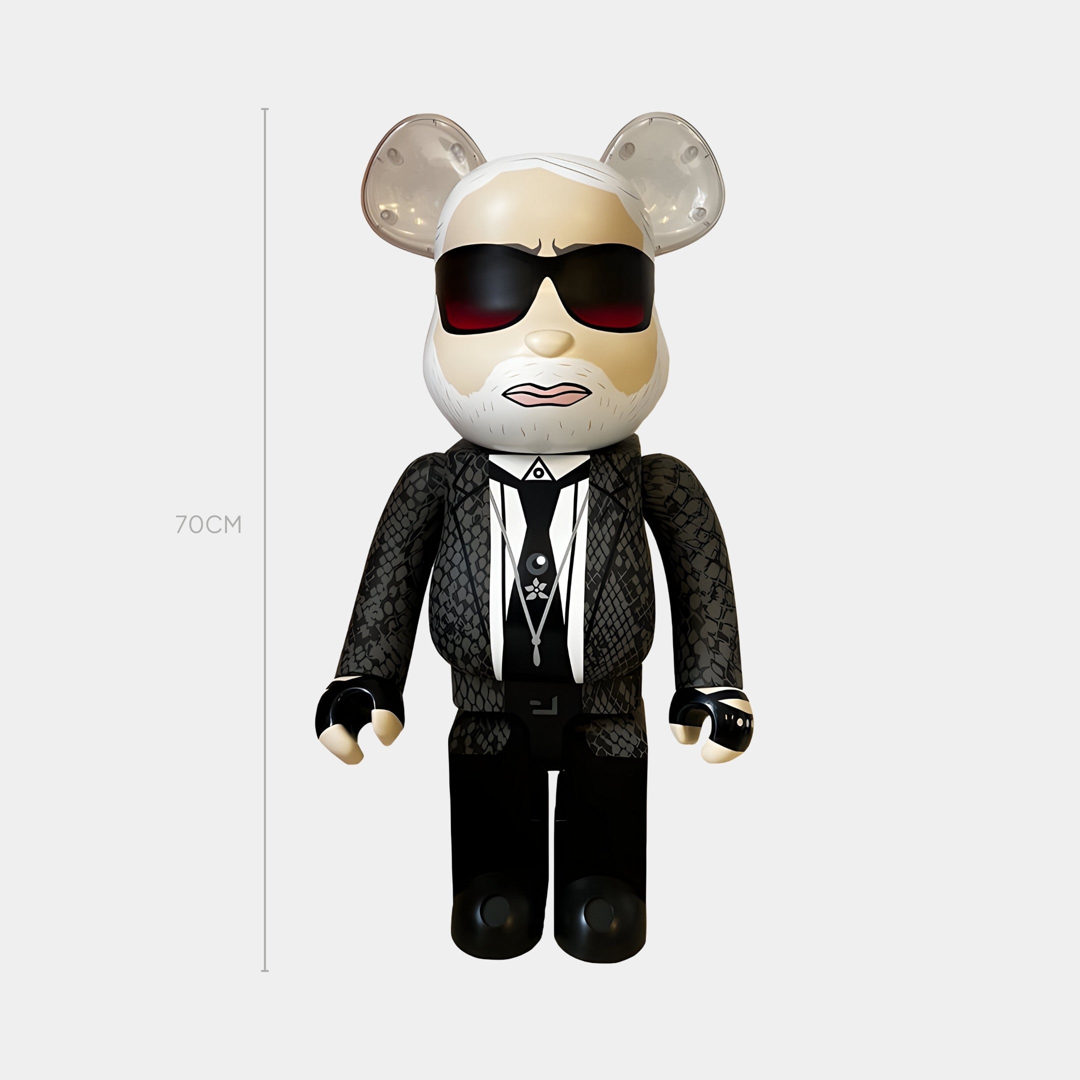 The Bearded Gentleman Bear Sculpture - 70cm by Giant Sculptures features a monochrome-suited bear in patterned black attire, white shirt, dark sunglasses, and white beard, standing sternly against a plain backdrop.