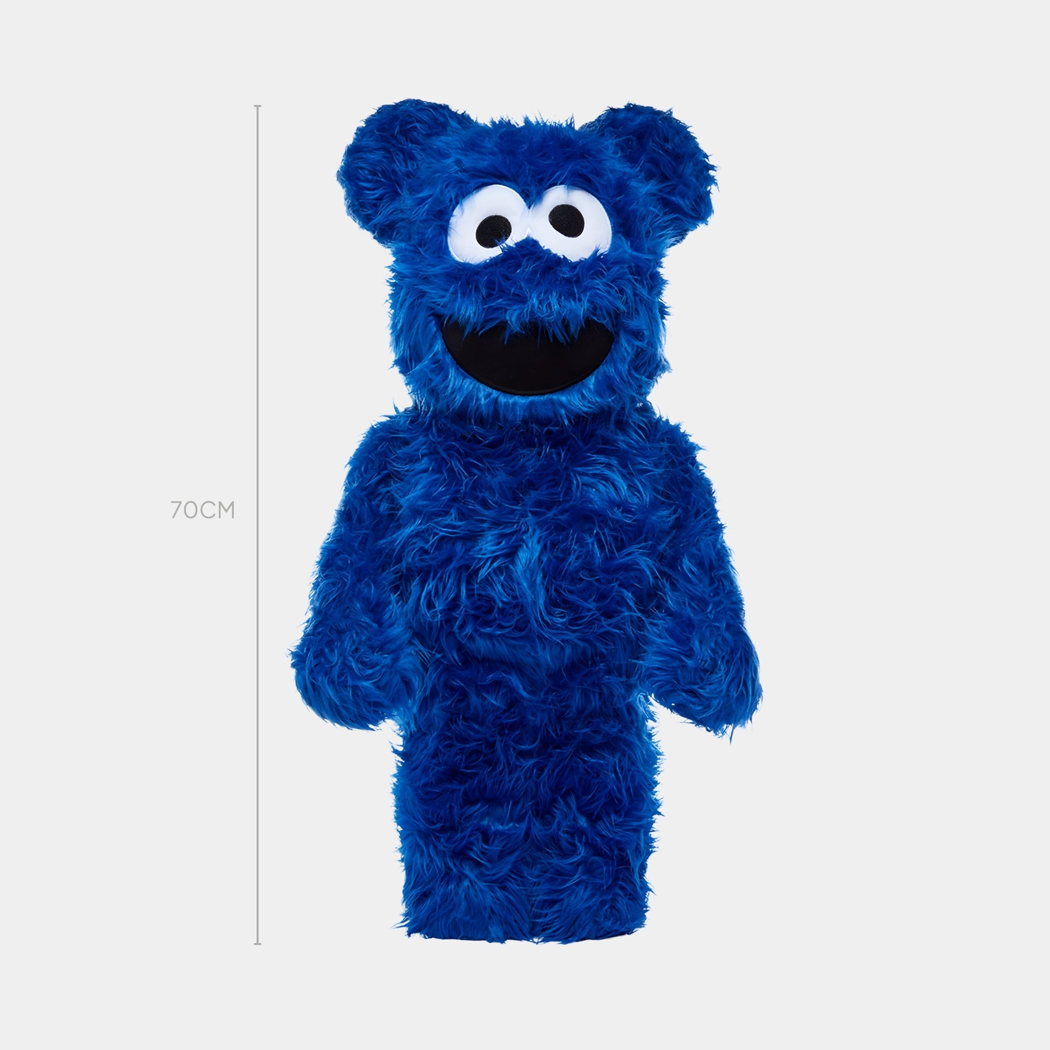 The Blue Fuzzy Bear Sculpture - 70cm by Giant Sculptures stands upright, featuring a fluffy blue design with large white eyes and a wide open mouth. A line to the left marks its height at 70 cm.