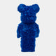 The Blue Fuzzy Bear Sculpture by Giant Sculptures stands upright at 70cm, displaying its cobalt-blue fur and bear-like form from behind against a plain white background.