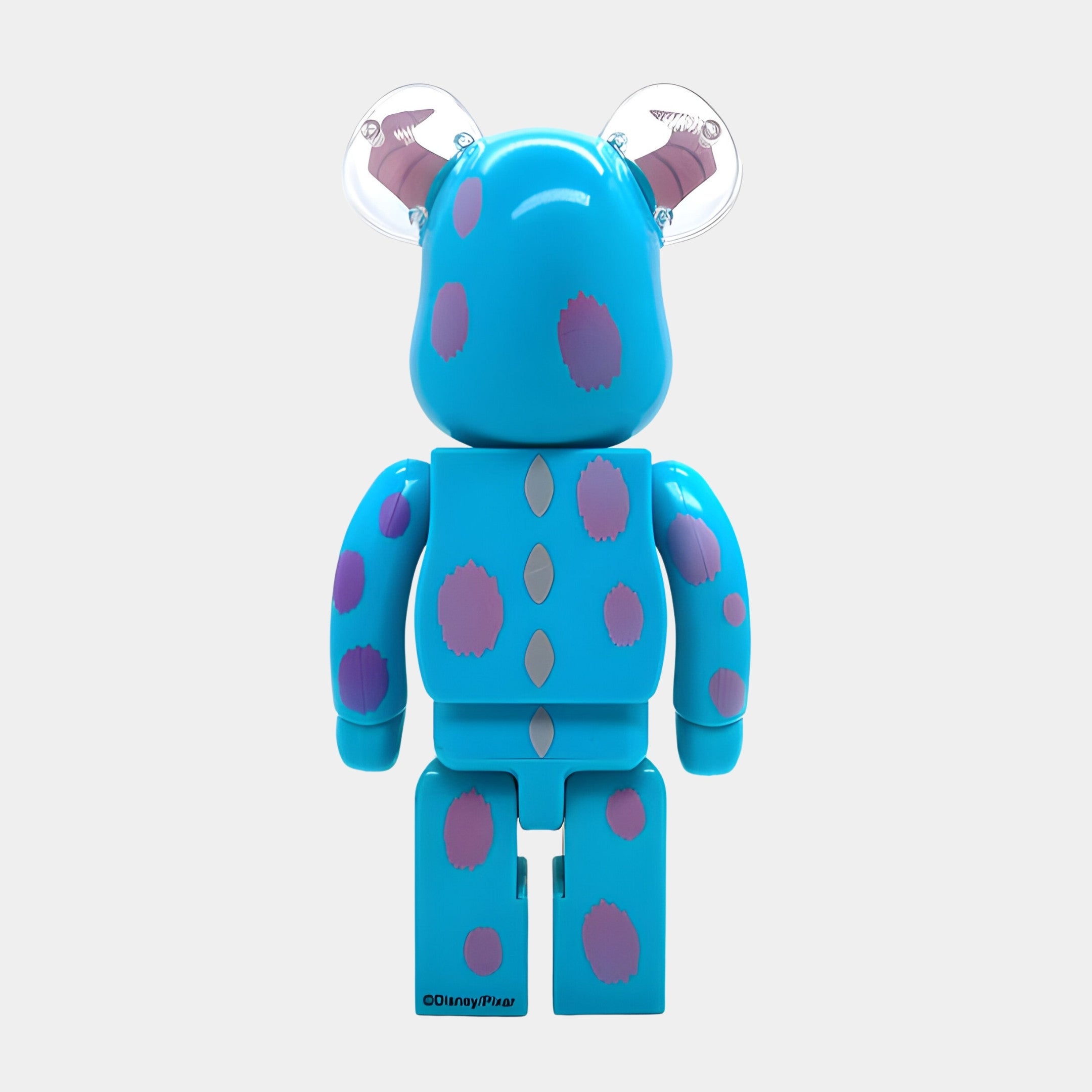 The Blue Spotted Horn Bear Sculpture - 70cm by Giant Sculptures is a playful resin bear with purple spots, gray claws, and transparent horns, standing upright and facing away; inspired by a beloved Disney/Pixar character.