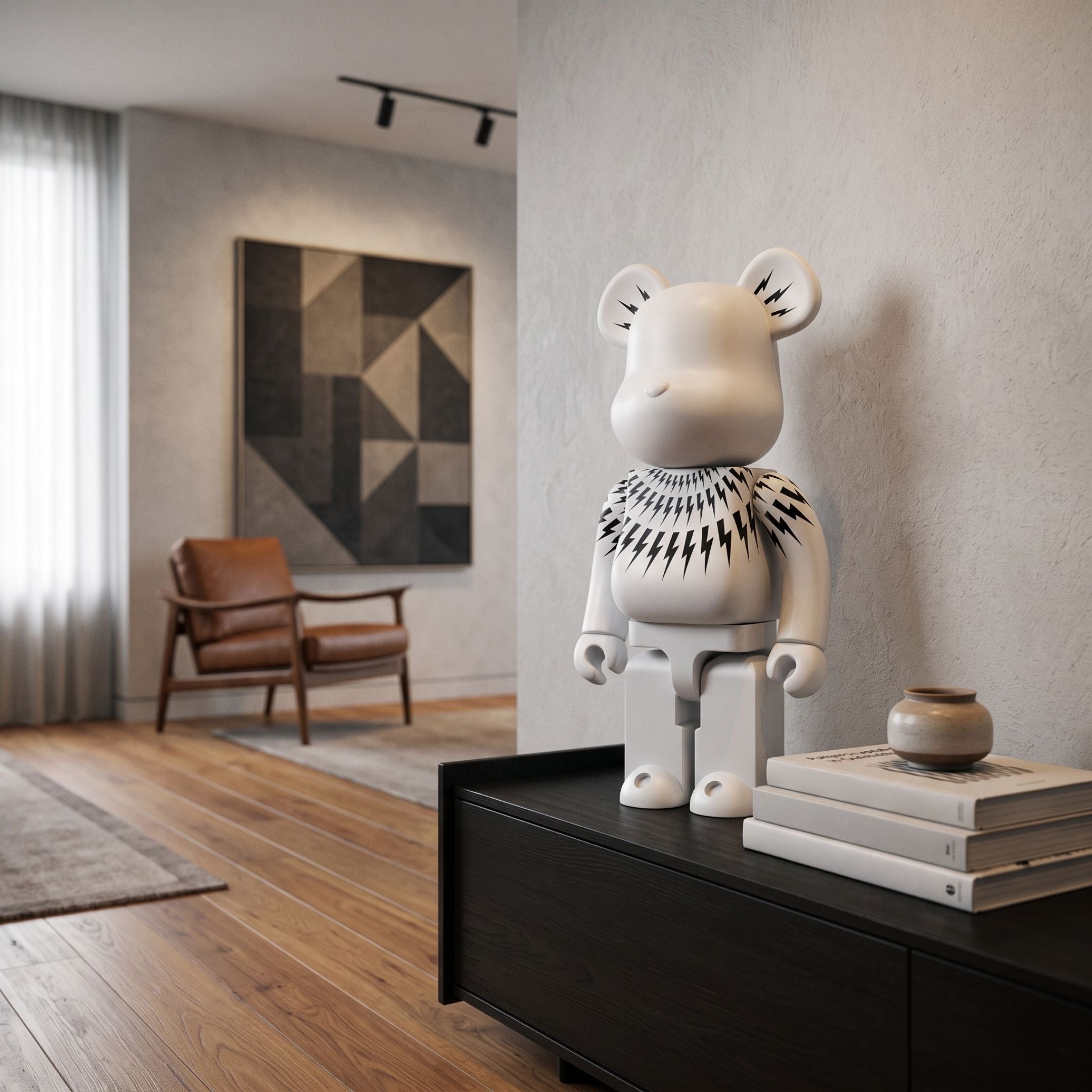 Bolt Collar White Bear Sculpture, 70cm, with black lightning bolt collar graphic, displayed on a dark sideboard in a living room with books, a vase, and abstract wall art.