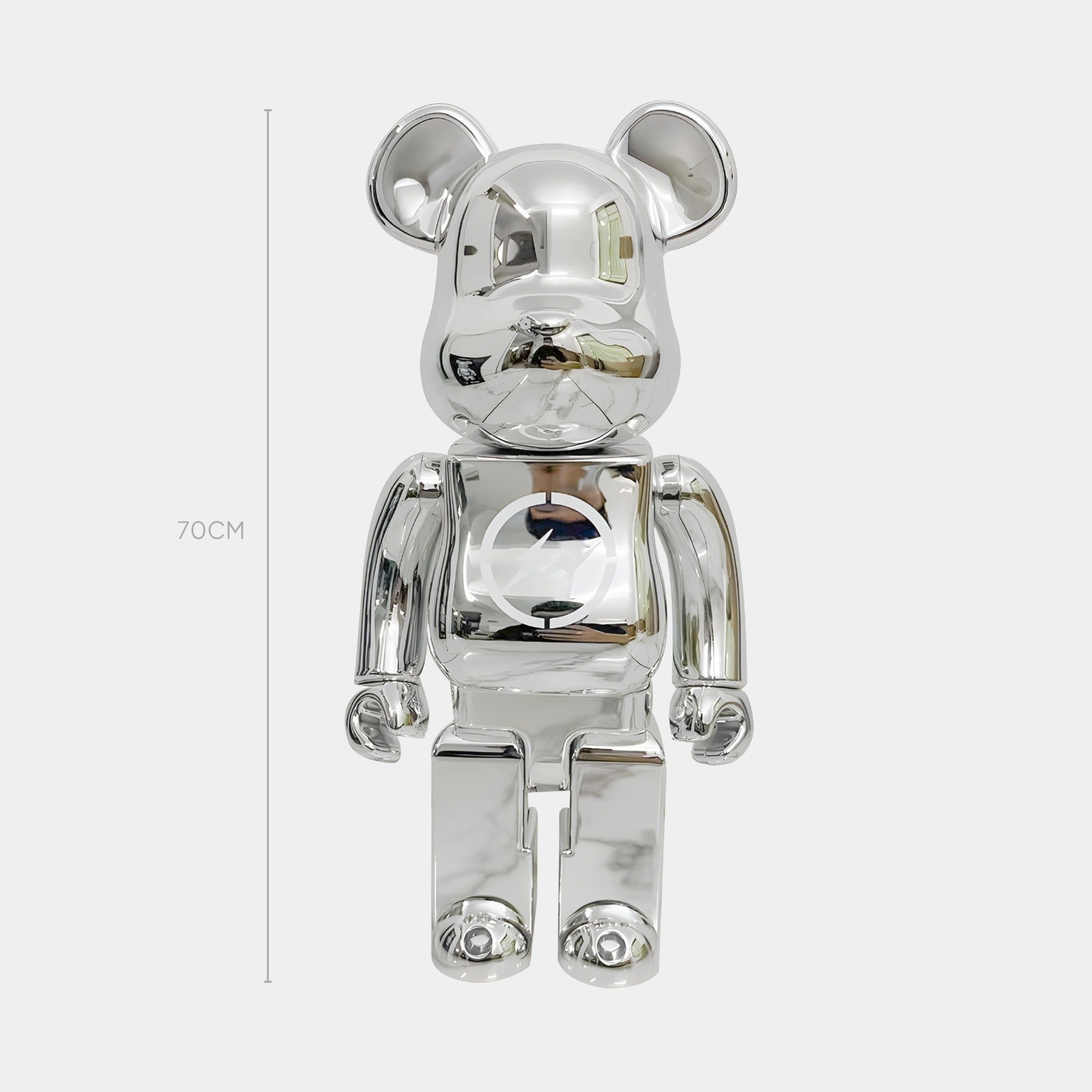 The Bolt Emblem Chrome Bear Sculpture by Giant Sculptures stands upright at 70cm with a reflective silver chrome finish, set against a plain background and proudly featuring the Bolt Emblem.