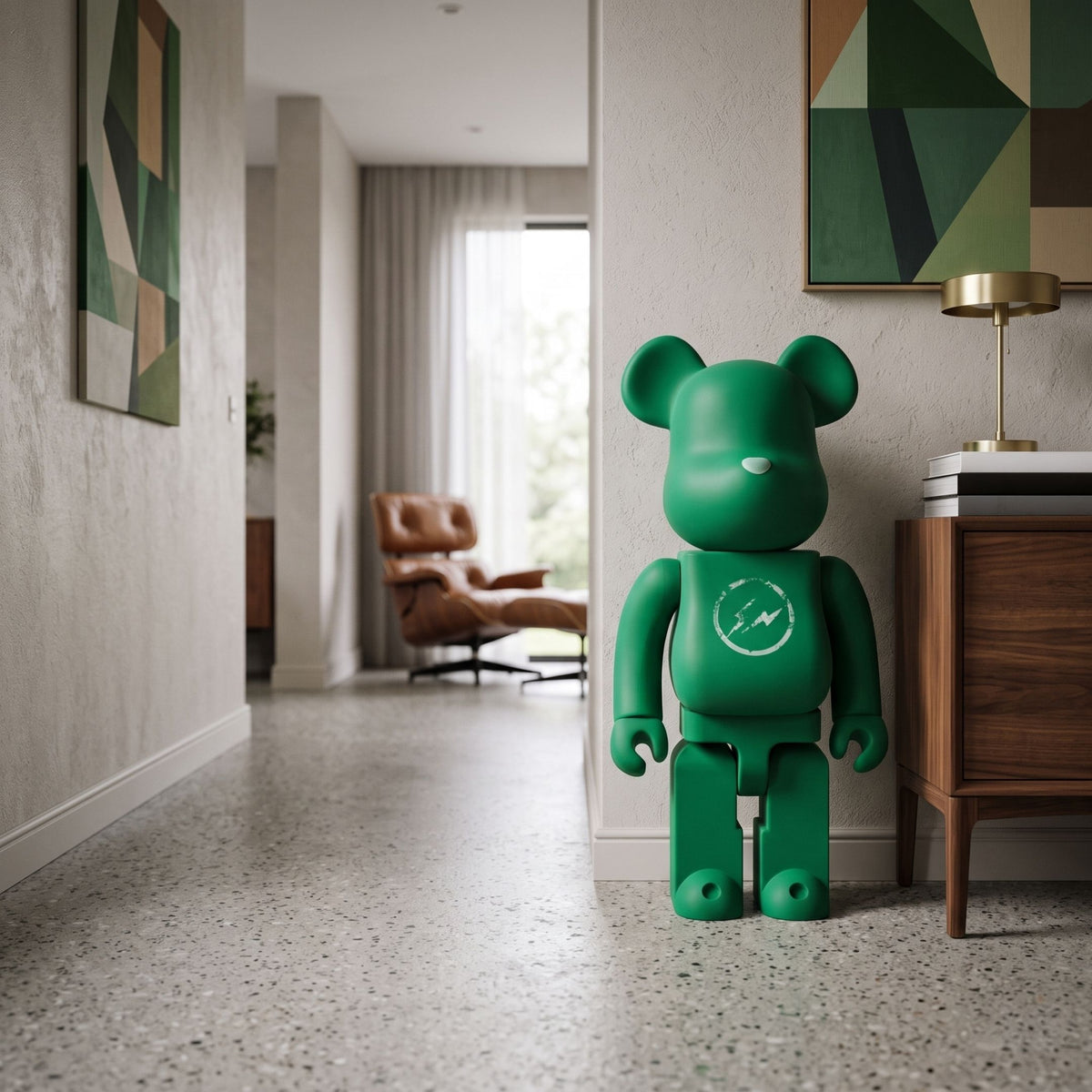Bolt Emblem Green Bear Sculpture (70cm) by Giant Sculptures in matte emerald with chest emblem, standing in a hallway near a wooden console and framed art.