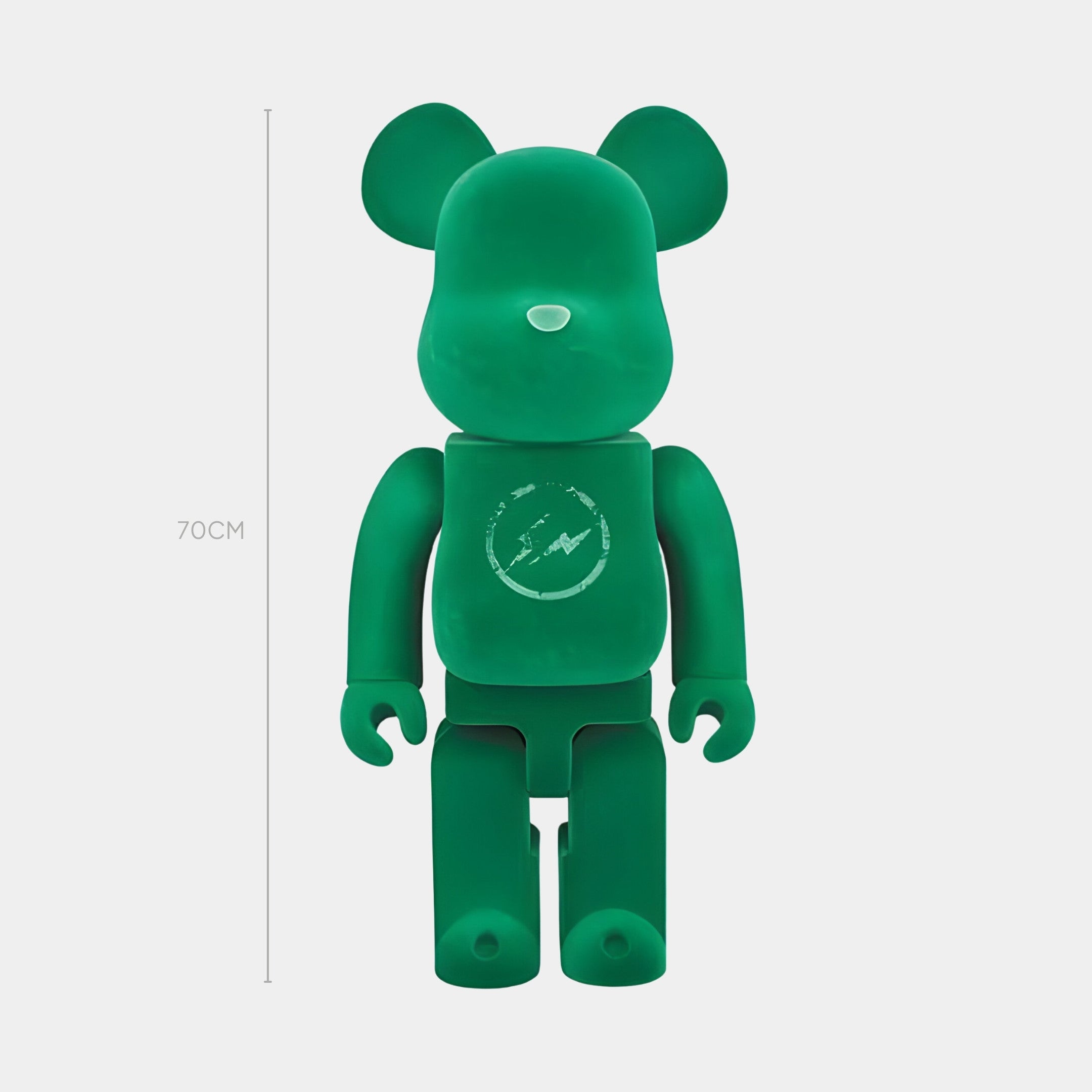 The Giant Sculptures Bolt Emblem Green Bear Sculpture stands 70 cm tall, features a matte-emerald finish, and displays a scratched circular emblem on its chest. This limited-edition piece is shown against a plain white background.