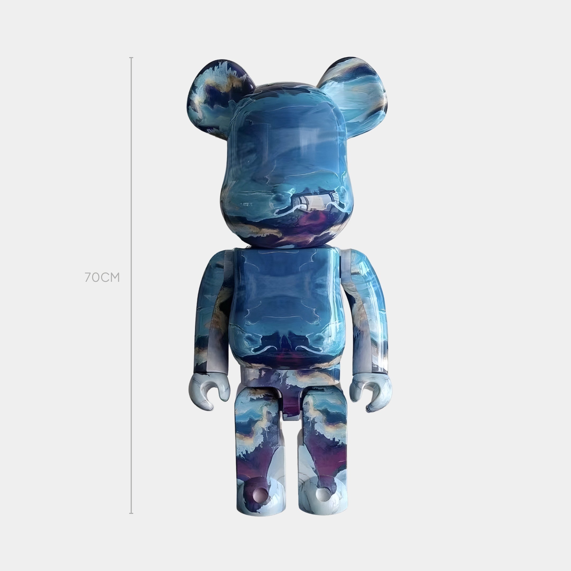 The Brushstroke Horizon Bear Sculpture - 70cm by Giant Sculptures is a limited edition art toy featuring a glossy finish and swirling blue, white, and purple patterns reminiscent of abstract clouds or water against a plain light gray background.