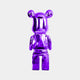 The Phantom Purple Bear Sculpture - 50cm by Giant Sculptures, features a shiny metallic hue and an electroplated finish, standing upright to display its smooth, reflective surface. Crafted from premium resin, it embraces a minimalist design with round ears and a simplistic facial structure against a plain white backdrop.