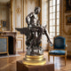 Large Classical Bearded Figure on Eagle Bronze Sculpture, 120cm, on gilt plinth in an ornate room beside a blue velvet armchair.