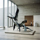 Large Contemporary Flying Cranes Bronze Sculpture by Giant Sculptures, 250cm dark patinated flock lifting off, displayed on a low plinth in a concrete gallery.