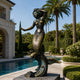 Monumental Classical Mermaid Bronze Statue by Giant Sculptures with mixed dark brown, gold, and verdigris patina, posed on a wave base beside a poolside garden with palms.