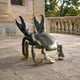 Large Contemporary Crab Bronze Sculpture by Giant Sculptures with raised claws and dark grey-green patina, displayed on a stone terrace beside a balustrade.