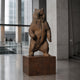 Monumental Standing Bear Bronze Sculpture by Giant Sculptures on a granite plinth in a concrete lobby, rearing upright with warm brown hand-finished patina.