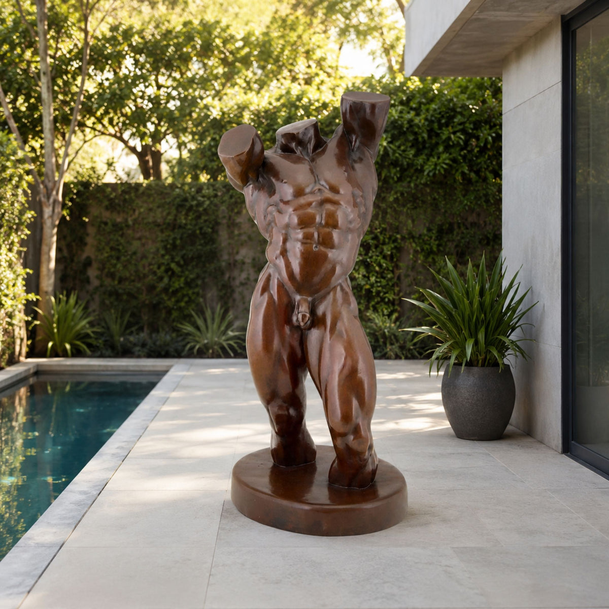 Monumental Contemporary Male Torso Bronze Sculpture, 210cm, headless armless bronze figure on round base beside a poolside patio with greenery.