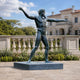 Life-Size Classical Nude Male Deity Bronze Sculpture, 220cm, on a granite base outdoors with a balustrade and mansion in the background.