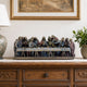 Classical Last Supper Relief Bronze Sculpture, 45cm, polychrome bronze figures on a draped table, displayed on a wooden sideboard beneath a framed painting.