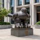 Monumental Contemporary Rotund Pigeon Bronze Sculpture, 180cm, dark bronze finish on a stone base outside a glass and stone office building.