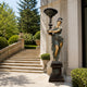 Life-Size Classical Goddess Lamp Bearer Bronze Sculpture, 240cm, bronze figure with gold accents holding a lamp post, on a pedestal beside a stone building entrance.