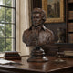 Classical Male Bust Bronze Bust, 80cm, in dark cast bronze on a round pedestal, displayed on a wooden desk in a library-style study.