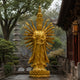 Monumental Traditional Thousand-Armed Guanyin Bronze Statue, 300cm, gilded multi-armed figure with stacked crowned heads on a lotus base at a temple courtyard.