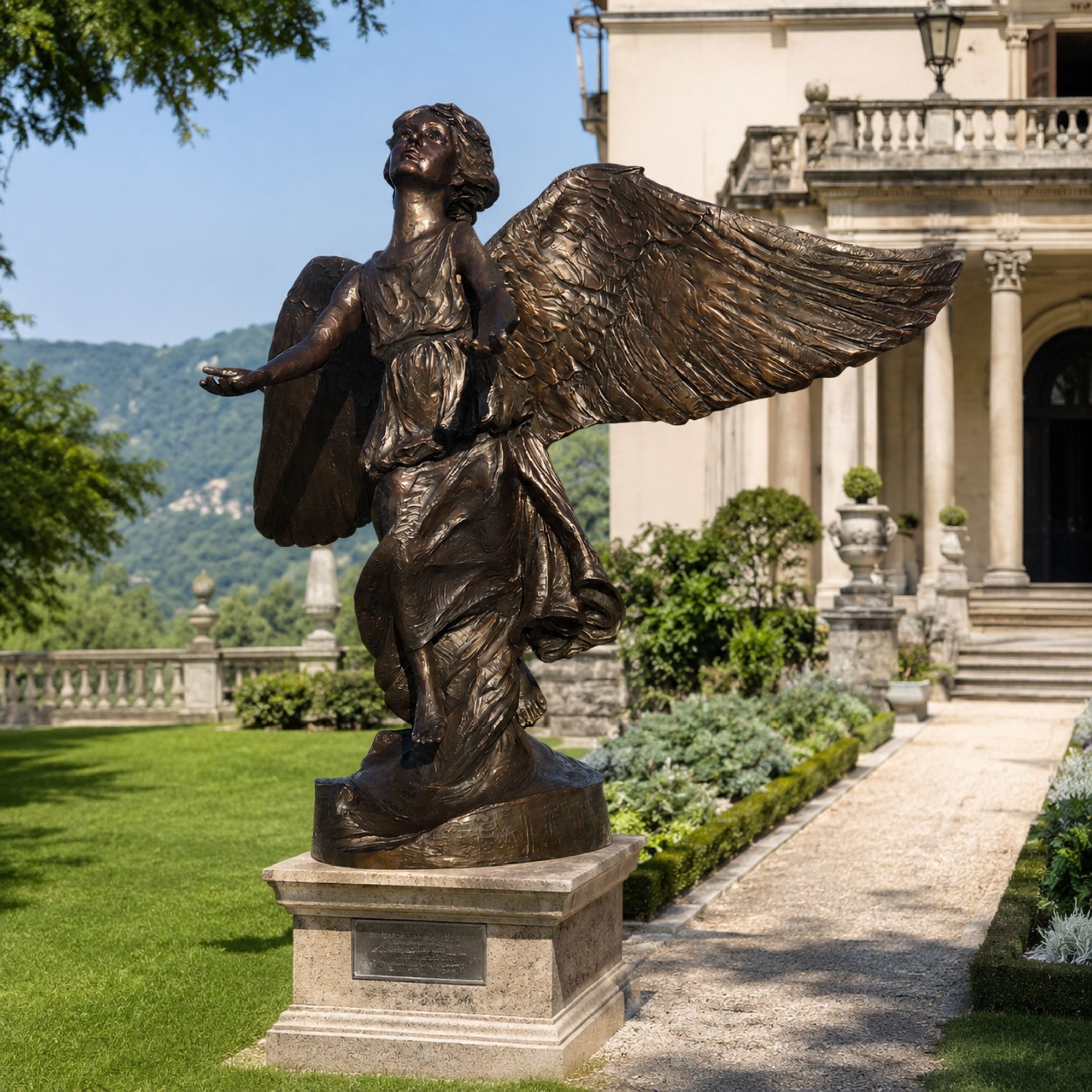 Large Classical Winged Angel Bronze Sculpture - 180cm, wings spread and arms open on a stone pedestal in a landscaped garden near a villa.