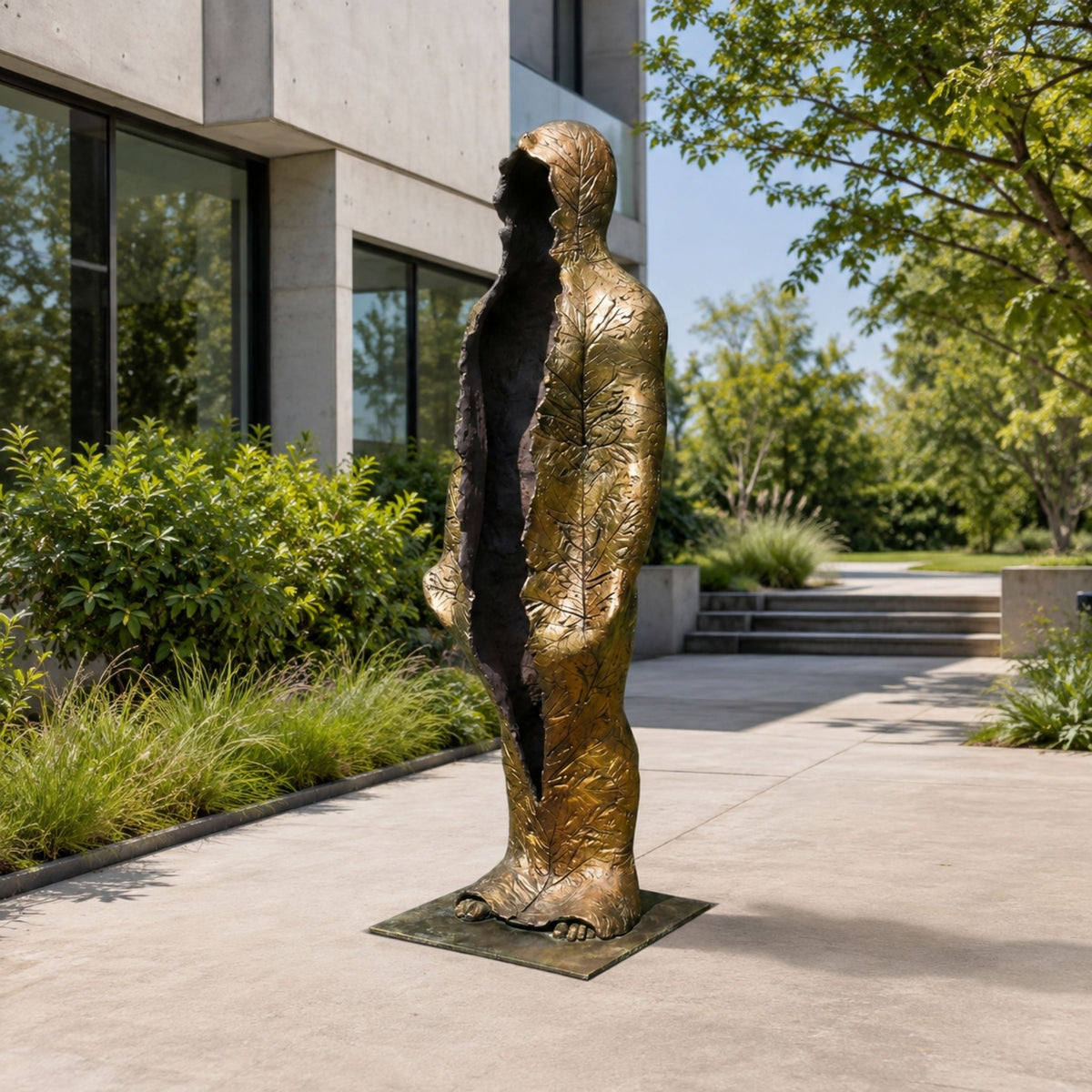 Life-Size Contemporary Emerging Figures Bronze Sculpture, 210cm, gold-toned leaf-textured figure with split hollow torso, displayed outdoors on a paved courtyard near greenery.