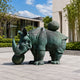 Life-Size Contemporary Armoured Rhinoceros Bronze Sculpture, 400cm, with segmented plating and sphere on its back, displayed outdoors on a paved plaza.