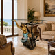 Classical Mermaid and Dolphin Bronze Sculpture, 90cm, gold mermaid with turtle and coral base supporting a glass table, shown in a living room by a sofa and sea-view window.