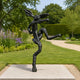 Large Contemporary Dancing Hare Bronze Sculpture, 150cm, black cast bronze hare balanced on one leg, arms outstretched, displayed on a stone plinth in a garden setting.