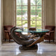 Classical Reclining Mermaid Bronze Table Sculpture by Giant Sculptures with glass top and books, set between velvet armchairs by garden-view French doors.