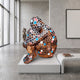 Contemporary Mosaic Figure Bronze Sculpture by Giant Sculptures, seated figure with hexagonal cells in bronze, black, white, coral, and turquoise, on a white plinth.