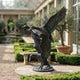 Large Traditional Flying Mallard Ducks Bronze Sculpture by Giant Sculptures, 180cm, three ducks ascending with spread wings, displayed in a courtyard garden.
