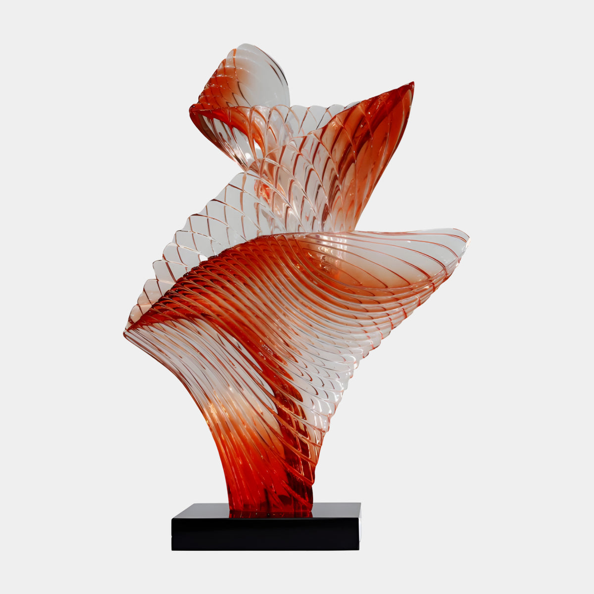 Red-Orange Furled Leaf Resin Sculpture on Marble, 102cm, with ribbed fan and curling blade forms on a black base, set against a plain white background.