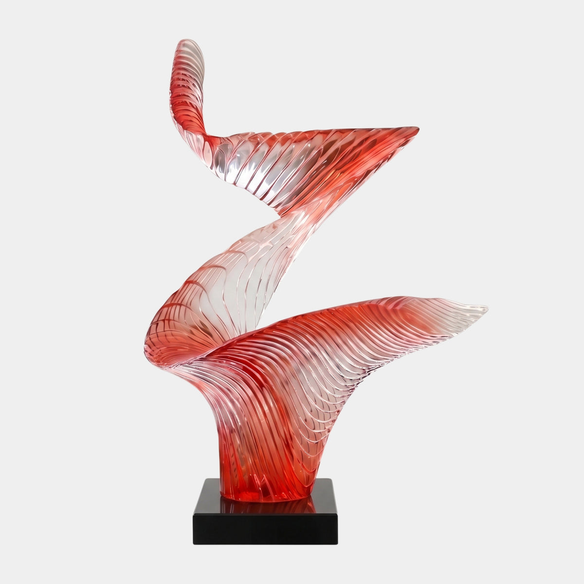 Red Ribbed Zigzag Twist Cast Resin Sculpture, 125cm, a ribbed red-to-clear ribbon form on a black base, shown against a plain light background.