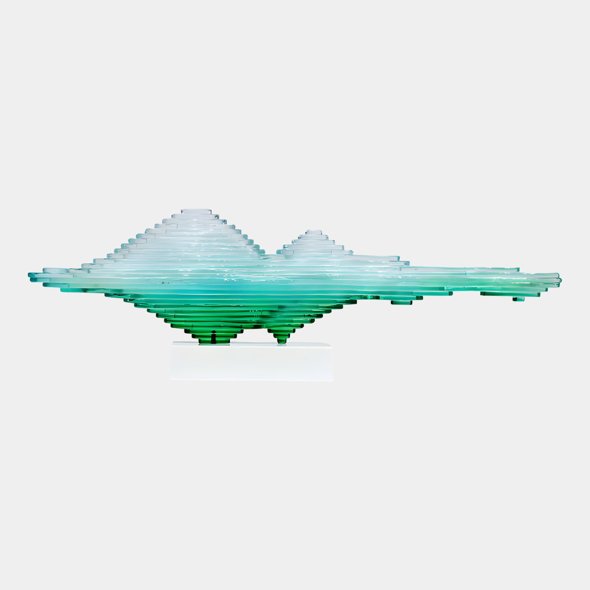 Green Stepped Horizon Range Resin Sculpture (80cm) by Giant Sculptures, mountain-like stepped layers fading from deep green to clear, on a pale block base against a light grey background.