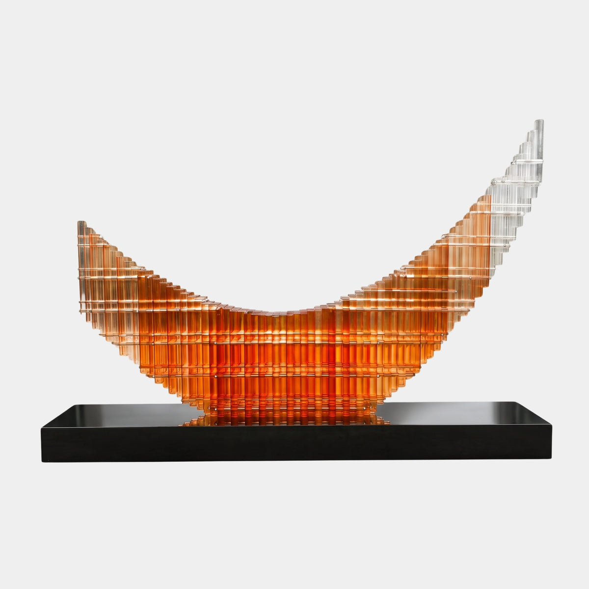 Orange & Clear Stacked Rod Crescent Acrylic Sculpture, 200cm, with color graduating from deep orange to clear at the horn tips, on a black rectangular base against a plain white background.