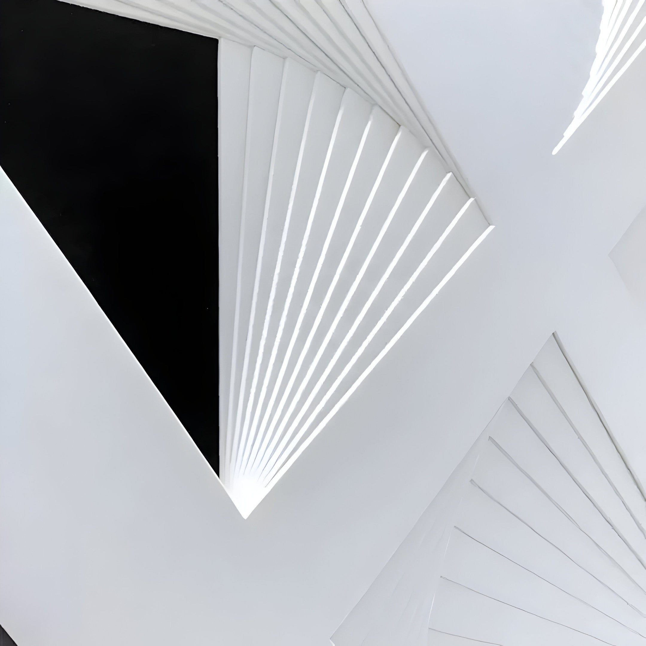 The Prismatics Black & White Geometric Cardboard Carving Wall Art from Giant Sculptures showcases an abstract design of overlapping white triangular structures on a dark canvas, creating a dynamic pattern that evokes depth and movement—ideal for contemporary design lovers.