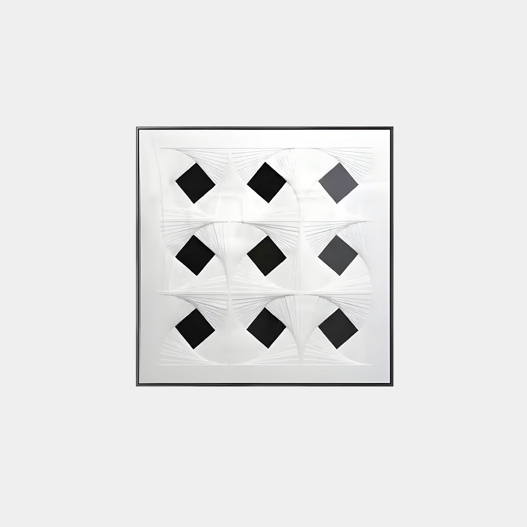 The Prismatics Black Diamond Patterned Cardboard Carving Wall Art by Giant Sculptures features nine black squares on a white textured background, bordered by curved linear patterns for dynamic depth, and set in a simple thin black frame.