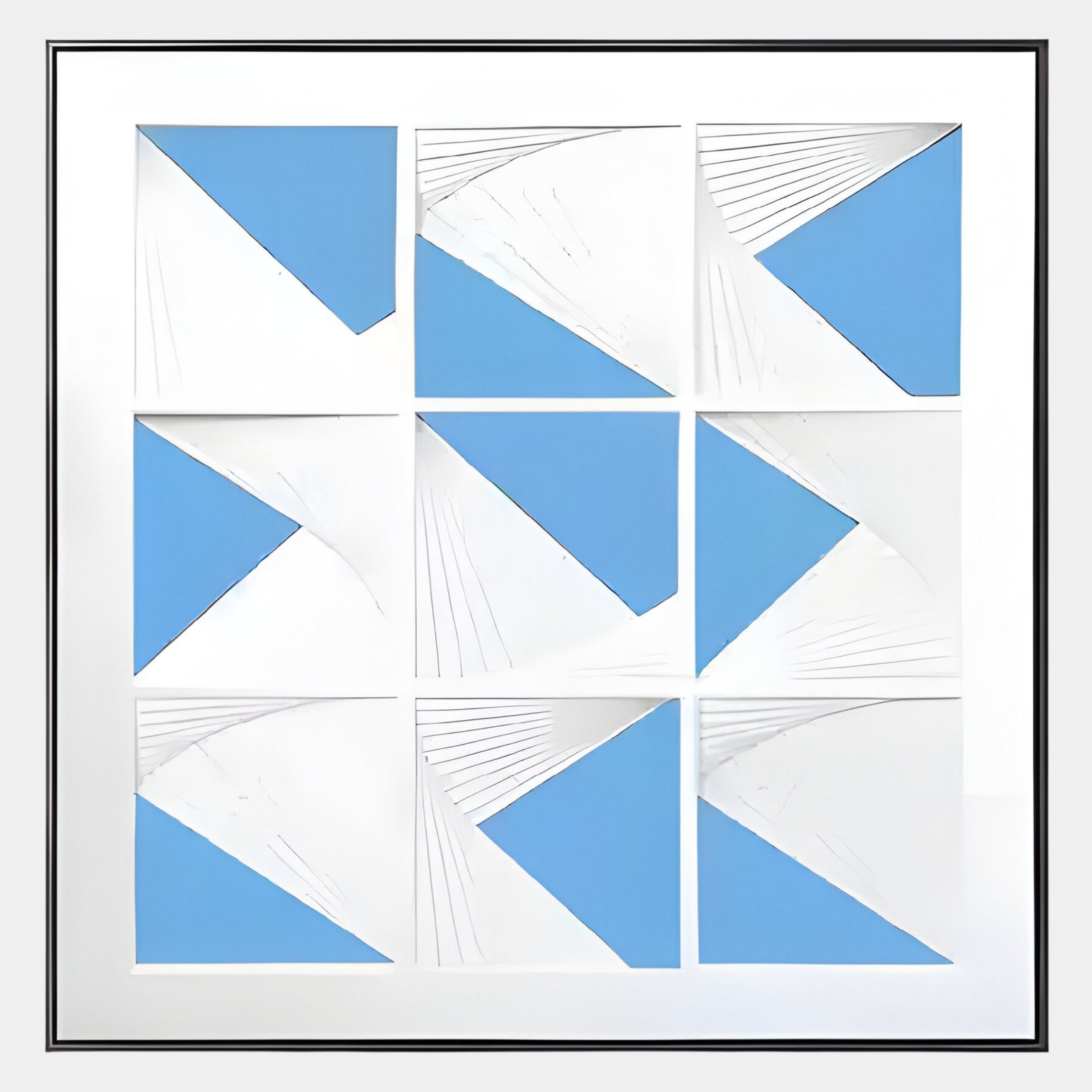 The Prismatics Blue Geometric Cardboard Carving Wall Art by Giant Sculptures features nine white squares with angular blue shapes and fine radiating lines in a 3x3 grid, all set within a white border and slim black frame.