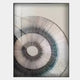 The Auralis Monochrome Concentric Circular Cardboard Craft Wall Art by Giant Sculptures features striking black and grey spiral lines on white, framed behind glass—ideal minimalist décor for modern spaces.
