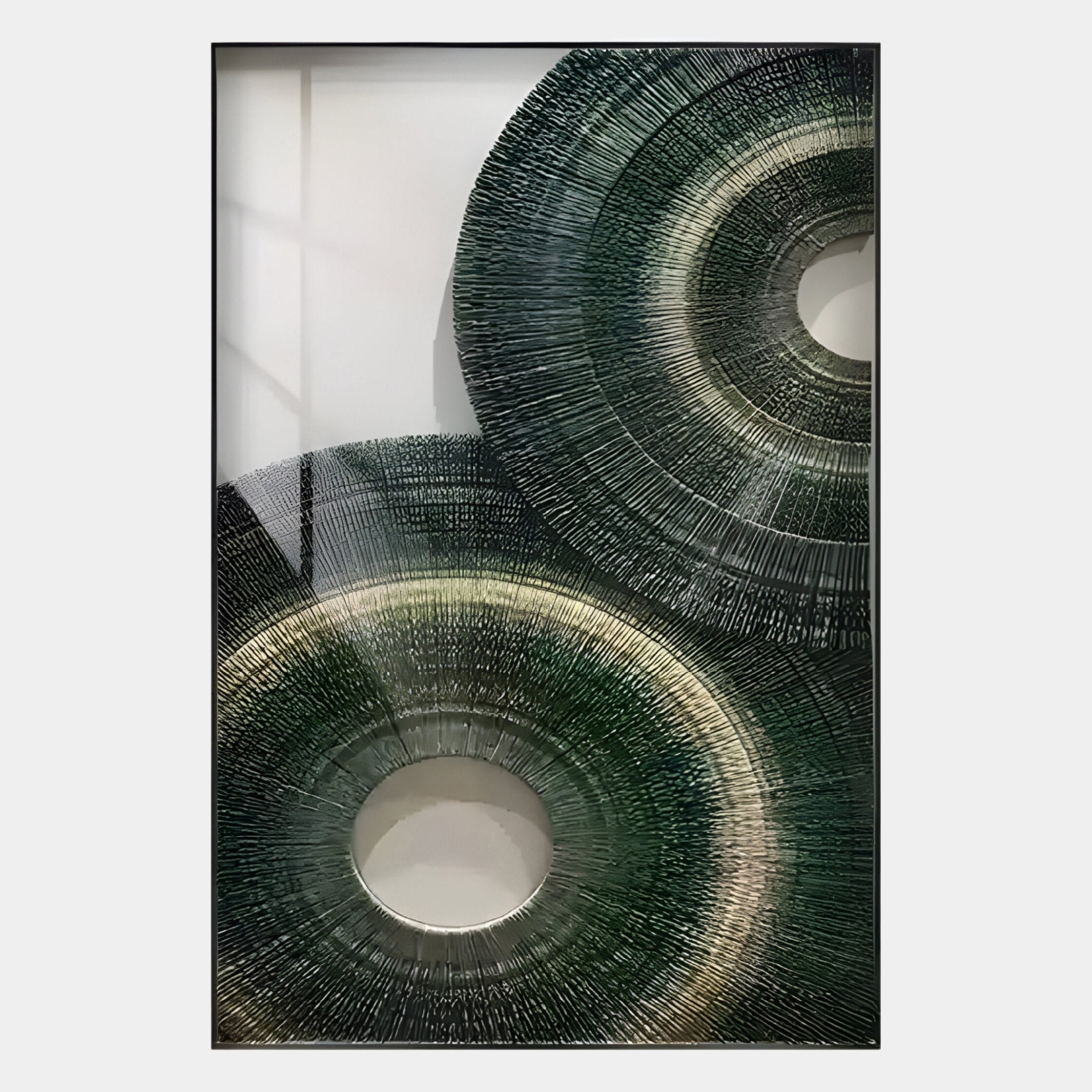 The Giant Sculptures Auralis Green Dual Concentric Circular Cardboard Craft Wall Art features overlapping green, gray, and black circles with textured lines on a white background in a rectangular frame—ideal for contemporary wall decor.