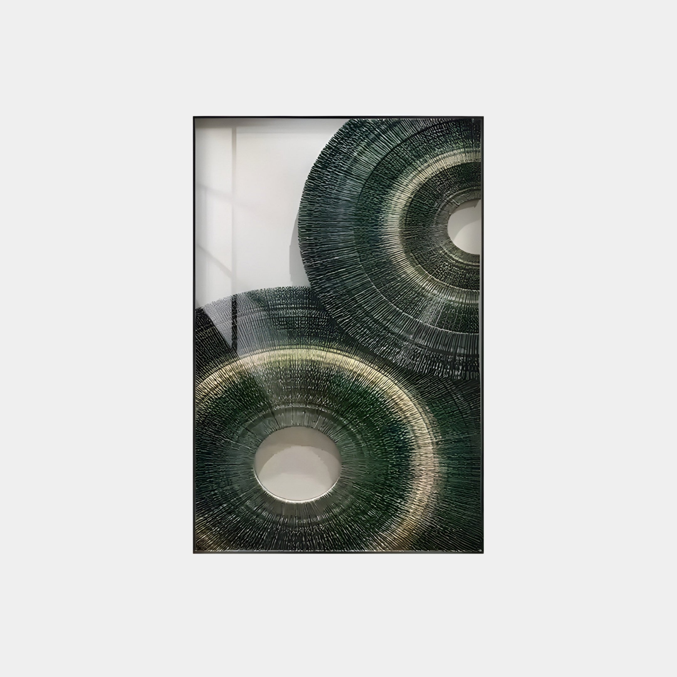 The Auralis Green Dual Concentric Wall Art by Giant Sculptures features overlapping circles of fine lines in dark green with lighter gradients, set on a neutral background within a rectangular frame—ideal for modern interiors.