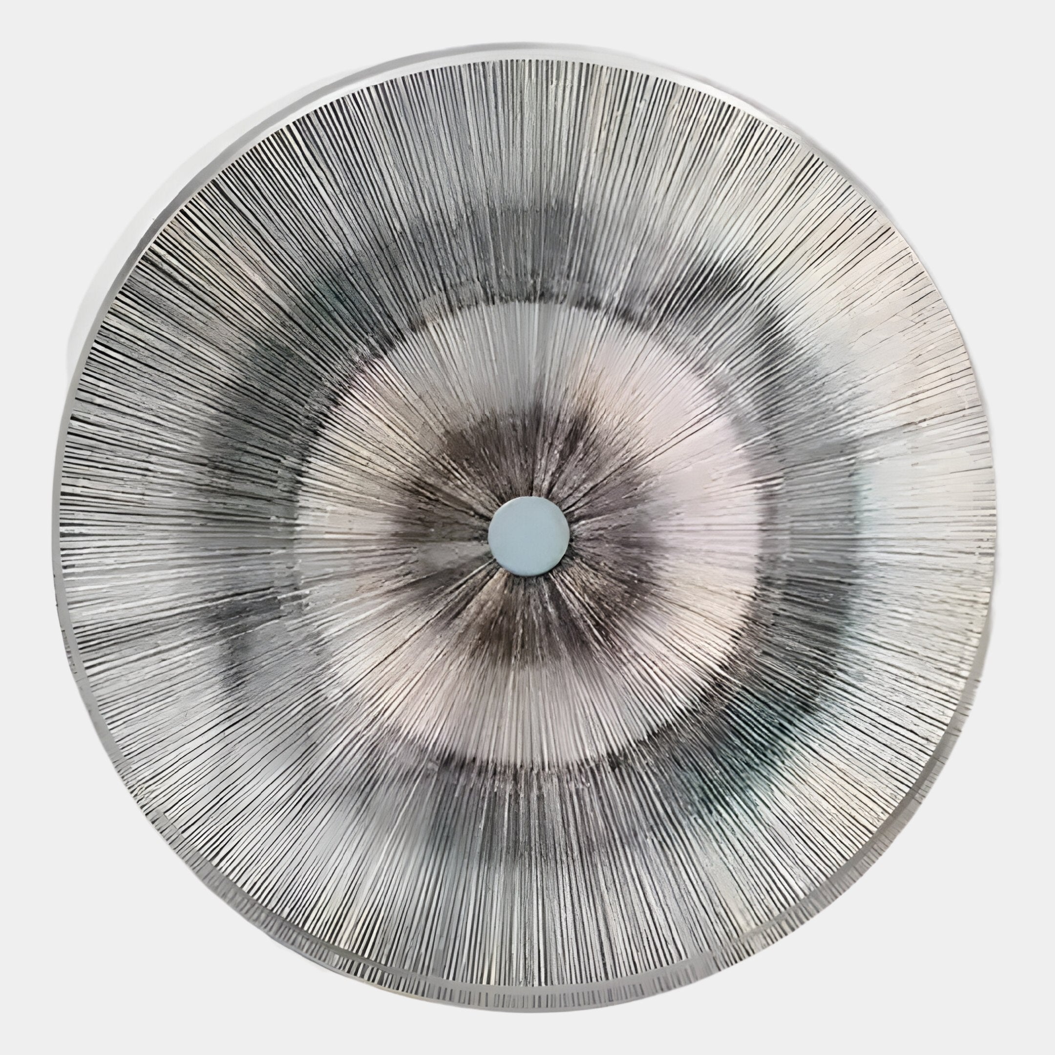The Oculis Aqua Luminous Circular Handmade 3D Paper Wall Art by Giant Sculptures features radiating black lines from a central point on white, evoking a metallic sunburst or stylized eye.