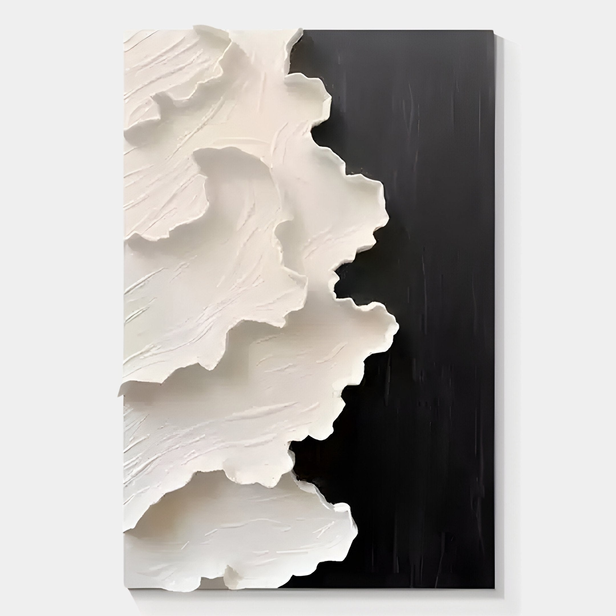 The Stratura III Black & White Layered Paper Canvas Wall Art by Giant Sculptures features textured, wavy white forms on the left over a matte black background, bringing striking contemporary style to any room.