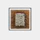 The Terracova Warm Ochre Frame Textured Cardboard Square 3D Wall Art by Giant Sculptures showcases stacked rectangular pieces in a warm ochre frame. The outer layer is brown, and the center white, creating a captivating three-dimensional appearance.