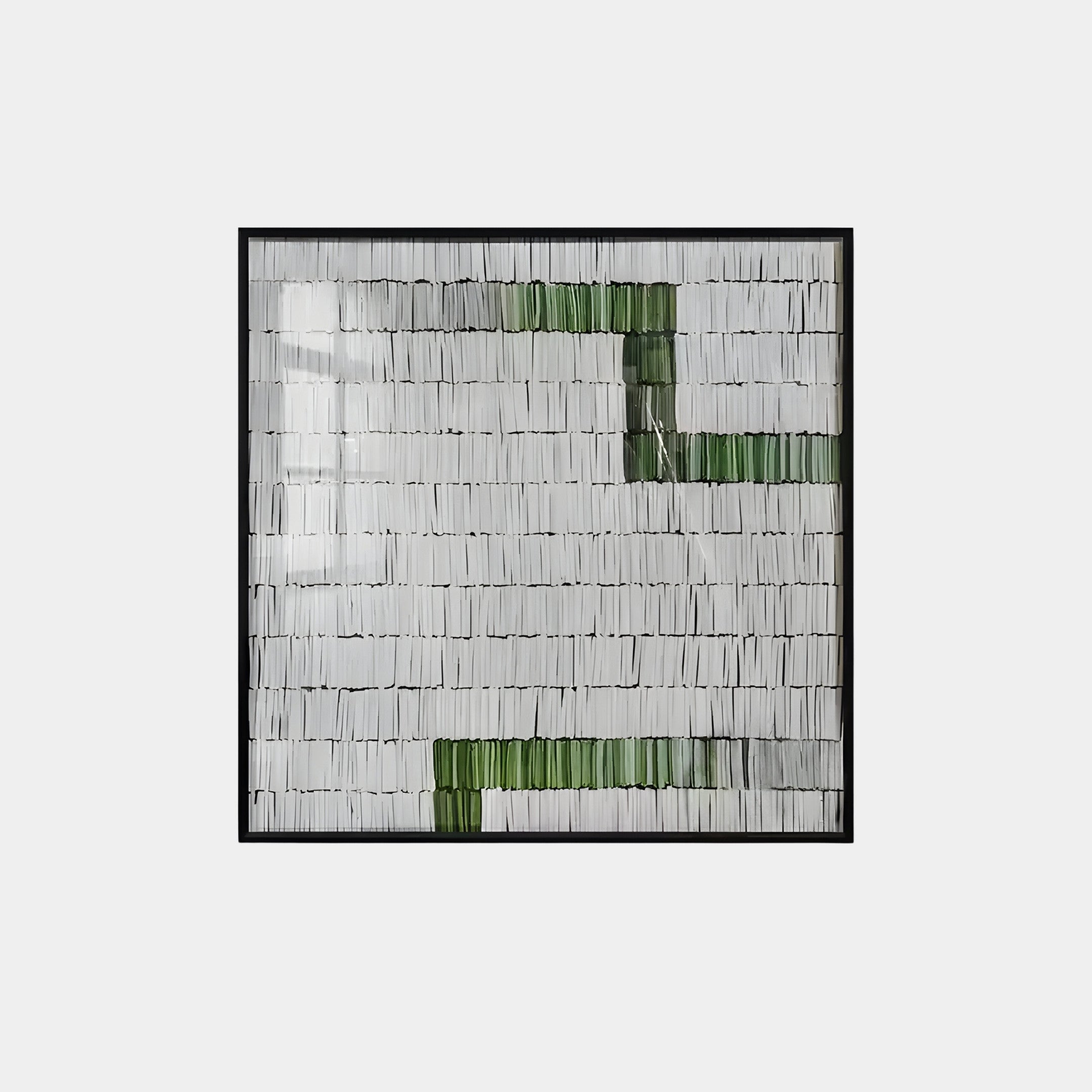 The Tracery IV Green & White Textured Paper Wall Art by Giant Sculptures showcases a captivating geometric design with a grid of vertically oriented rectangular strips. Predominantly white, the artwork features distinct green elements, all set against a light background for elegance.