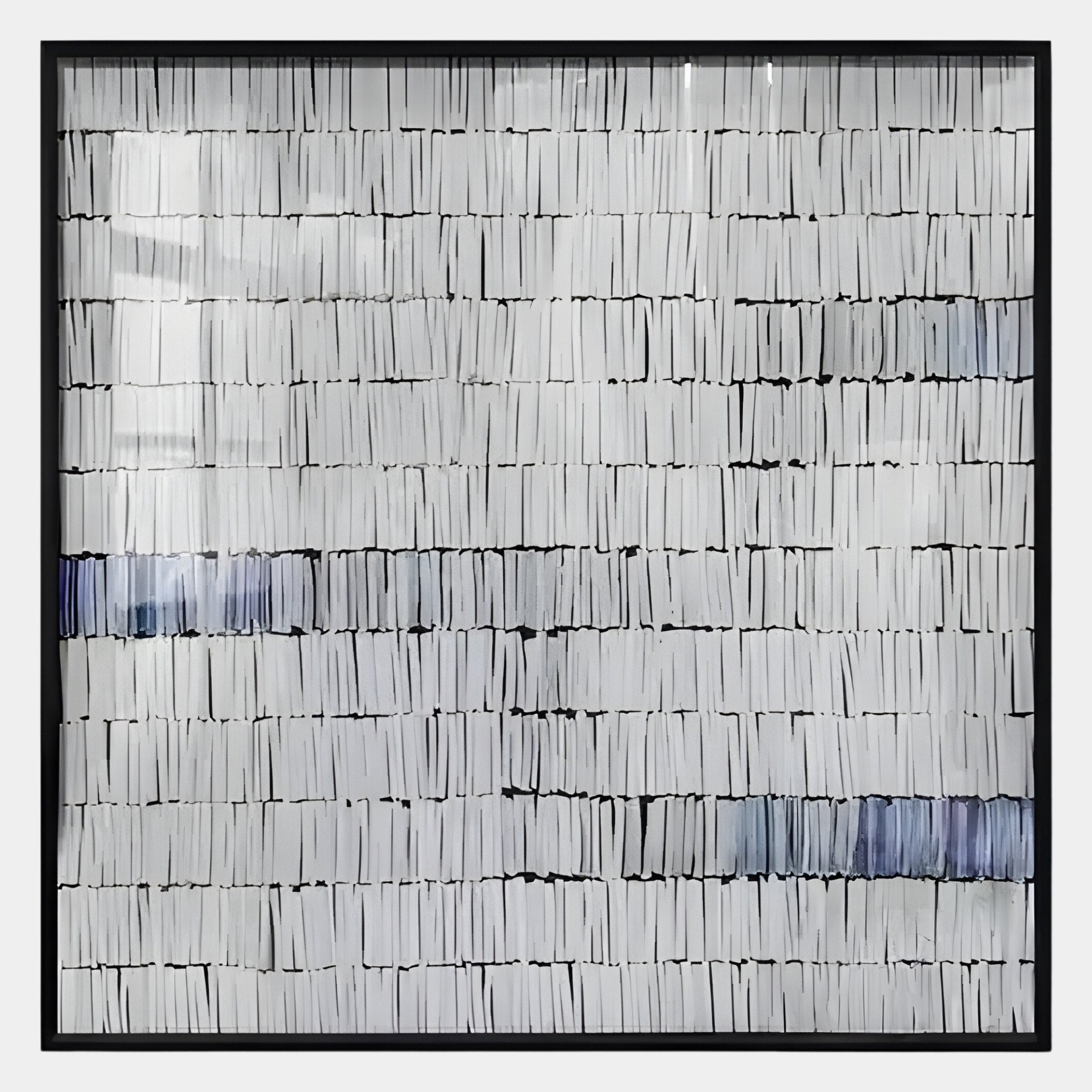 The Tracery VI Blue & White Textured Paper Wall Art by Giant Sculptures features rows of vertically stacked white books with black and navy spines, forming a subtle striped pattern.