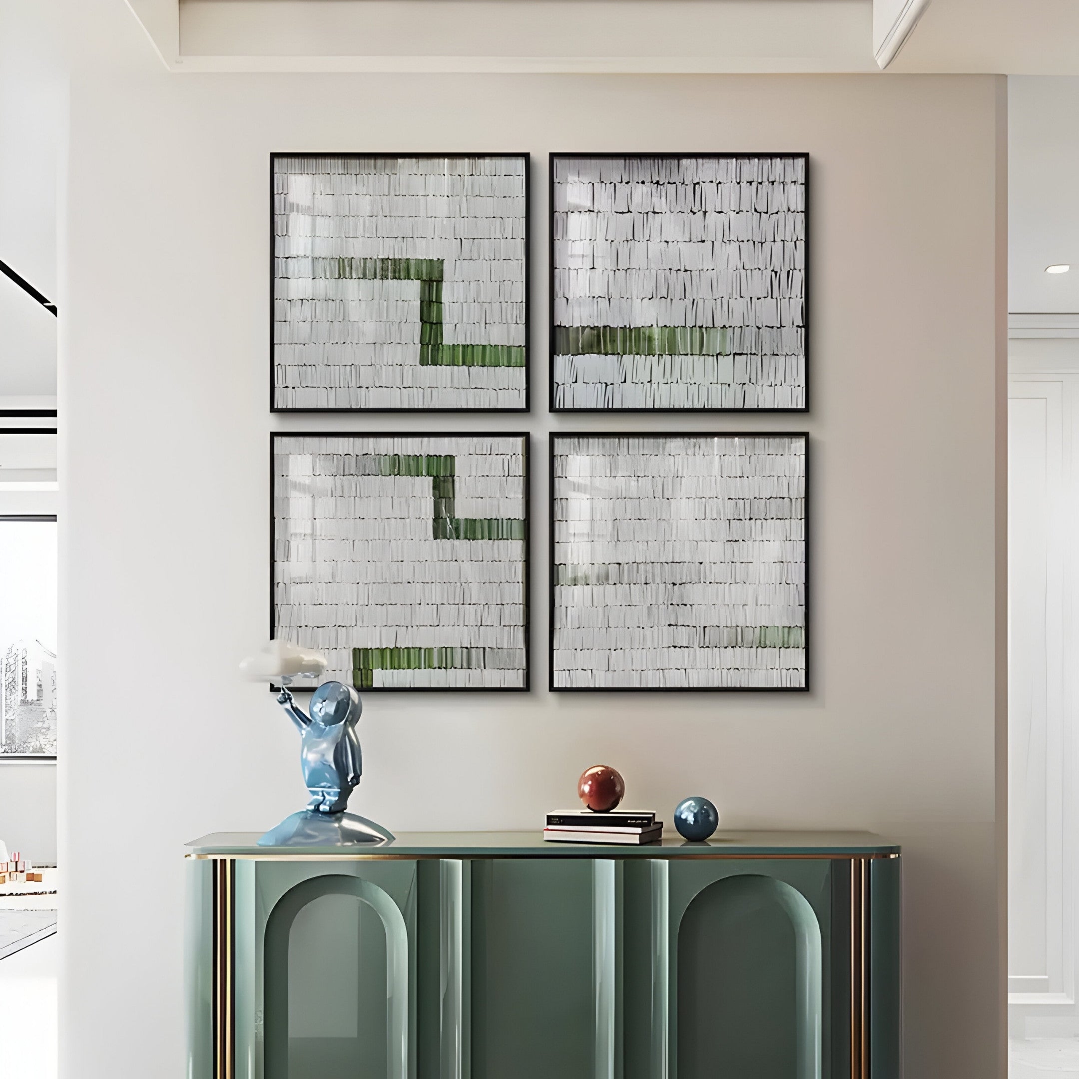 The wall features four Tracery III Green & White Textured Paper Wall Art pieces by Giant Sculptures in a two-by-two design. Below, a sleek console table showcases contemporary craftsmanship with a decorative blue sculpture and two spherical objects.