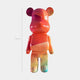 The Candy Bear Sculpture - 50cm by Giant Sculptures stands upright with a glossy finish and abstract orange, red, and green patterns. This limited edition art piece pops against a plain white background.