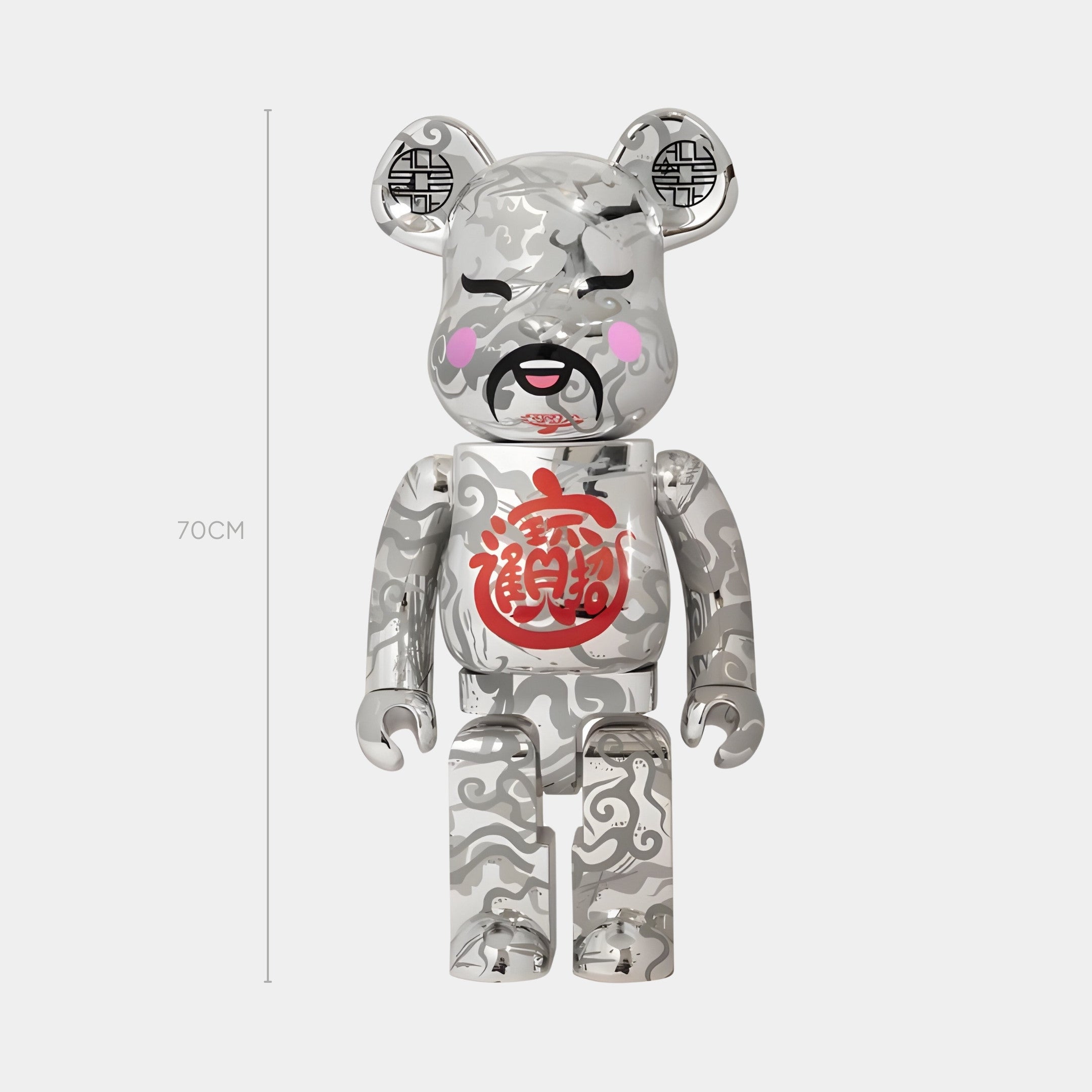 The Giant Sculptures Chinese Charm Chrome Bear Sculpture - 70cm features silver-chrome finish, swirling patterns, pink cheeks, and a red Chinese character. This limited-edition artwork stands upright beside a 70cm marker.